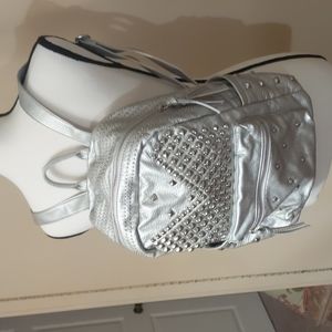 Silver embellished studded backpack super soft feels like leather. Very stylish.